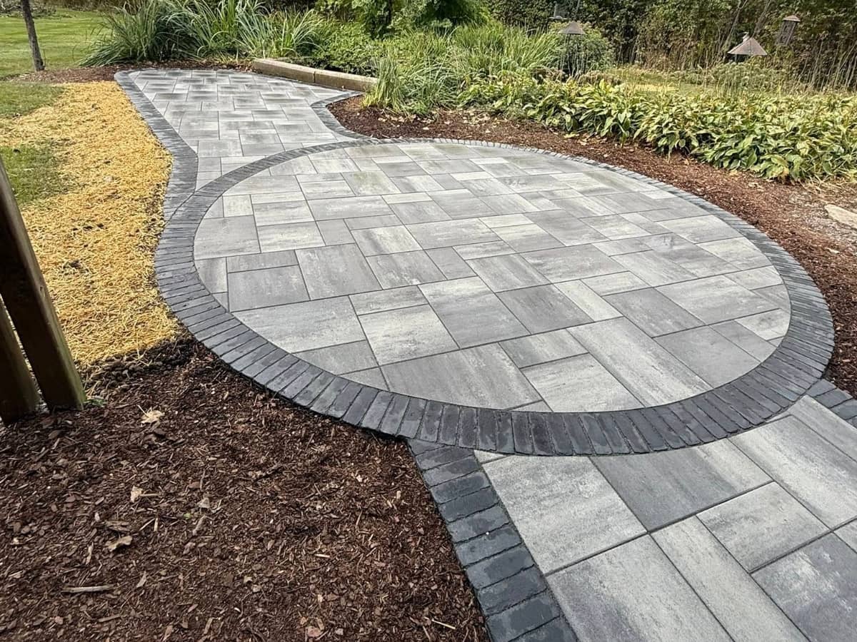 New Unilock Pavers (Beacon Hill paired with a Copthorne border) and Walls (Quarry smooth block with Ledgestone Copings)